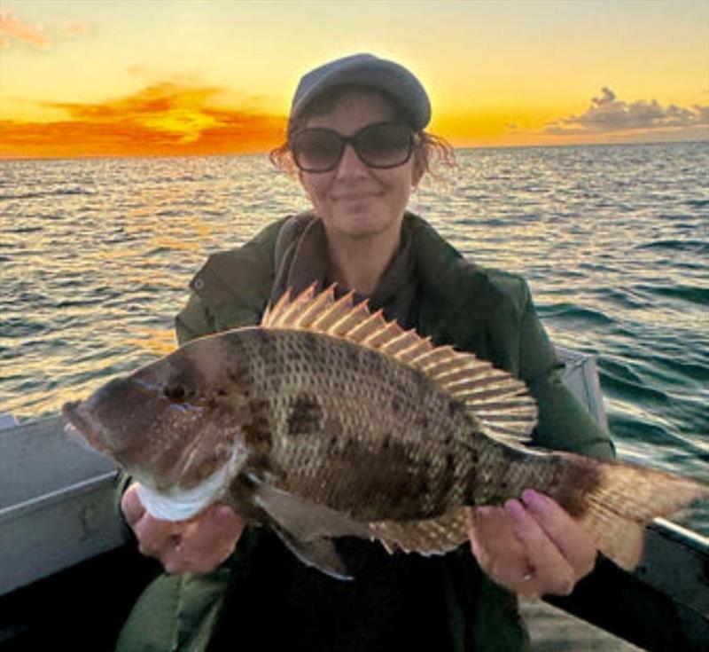 Mel with a chunky inshore sweetlip. They are quite prolific for now, but will thin out in winter - photo © Fisho's Tackle World