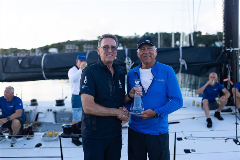 RORC CEO Jeremy Wilton presents skipper Ben Mitchell with the Monohull Line Honours trophy - RORC Caribbean 600 photo copyright Arthur Daniel / RORC taken at Royal Ocean Racing Club and featuring the IRC class