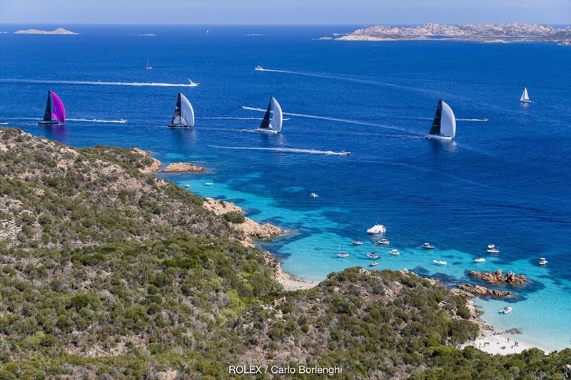 Fine, warm breeze, the craggy sandstone rock formations and azure blue waters are the reason crews return repeatedly to race off the Costa Smeralda at the Maxi Yacht Rolex Cup - photo © Rolex / Studio Borlenghi