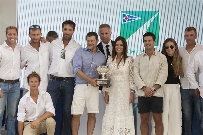 Miguel Galuccio, wife Veronica and the crew of Vera with the Mediterranean Maxi Offshore Trophy photo copyright Studio Borlenghi / International Maxi Association taken at  and featuring the Maxi class