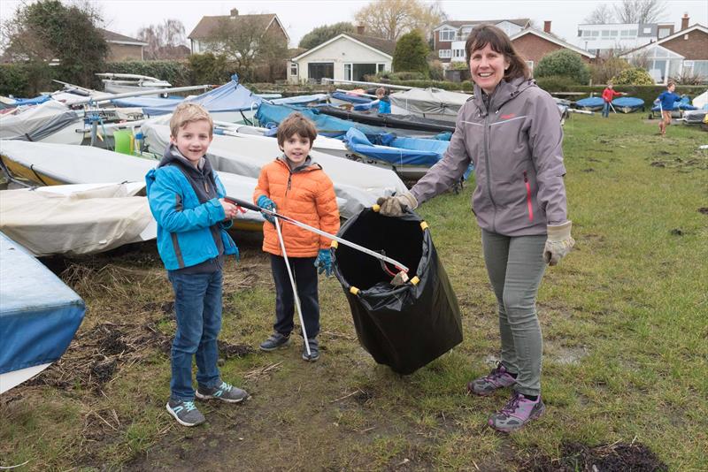 Victoria Lovell with Isaac Lovell and and Jack Addison cleaning the Emsworth SC boat park photo copyright Don Manson taken at Emsworth Sailing Club