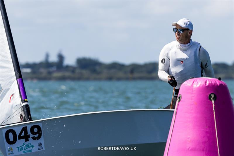 Steve McDowell, NZL on day 2 of the 2024 OK Dinghy World Championship Brisbane photo copyright Robert Deaves / www.robertdeaves.uk taken at Royal Queensland Yacht Squadron and featuring the OK class