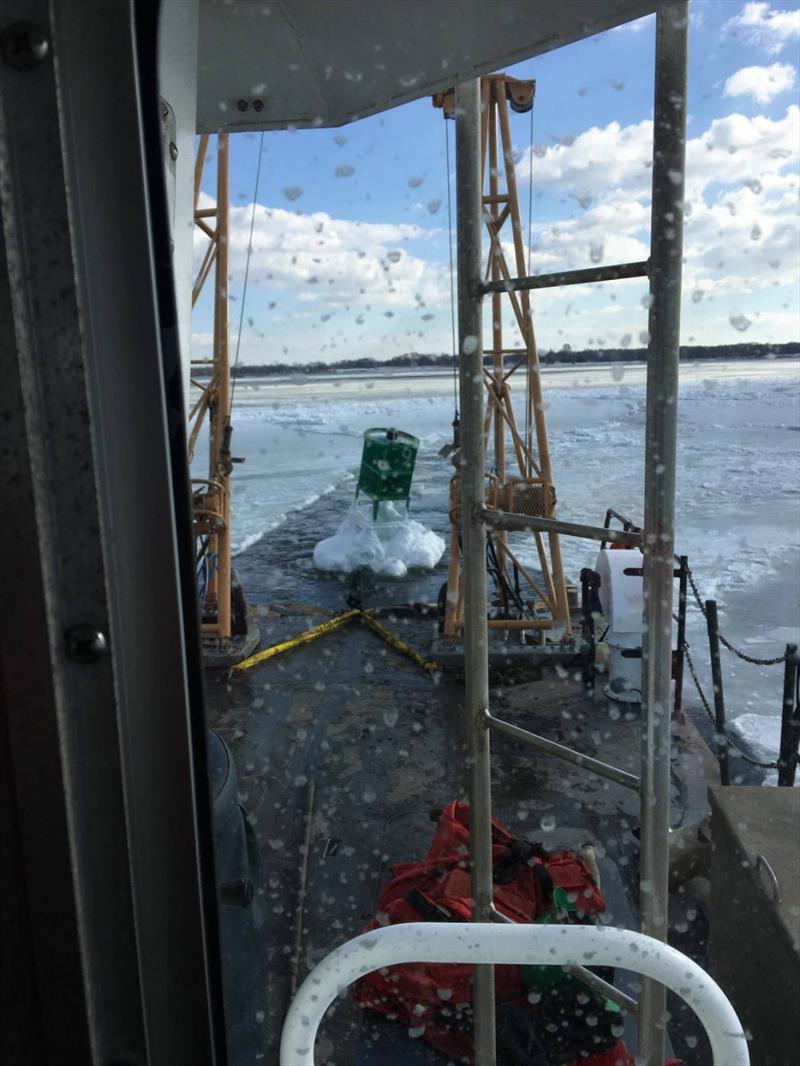 Coast Guard Aids to Navigation Team Bristol tows a buoy back to its proper position using a Buoy Utility Stern Loading (BUSL) boat, Tuesday, Jan. 9, 2018, in the Providence River. The buoy was knocked off station by ice  - photo © U.S. Coast Guard 
