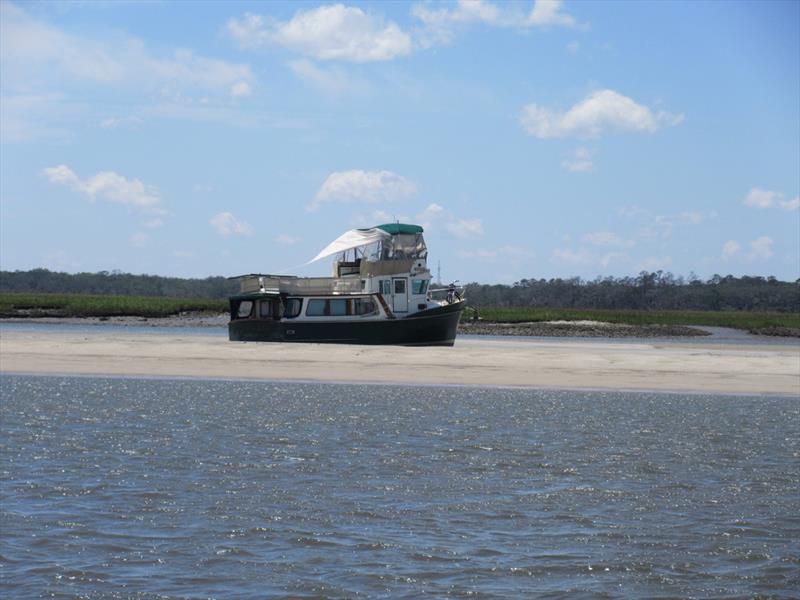Aground vessel photo copyright Waterway Guide Media taken at  and featuring the Power boat class