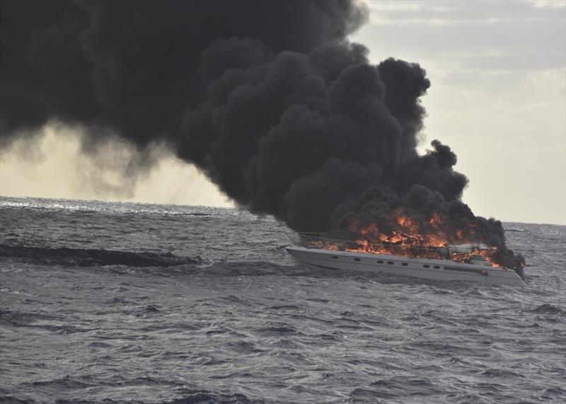 The pleasure craft, Family Time, sits in the water on fire approximately 30 miles east of Miami Beach, Friday, Dec. 7, 2018. The Coast Guard Cutter Robert Yered (WPC-1104) responded to the vessel on fire to assist the survivors. - photo © Petty Officer 2nd Class Jonathan Lally