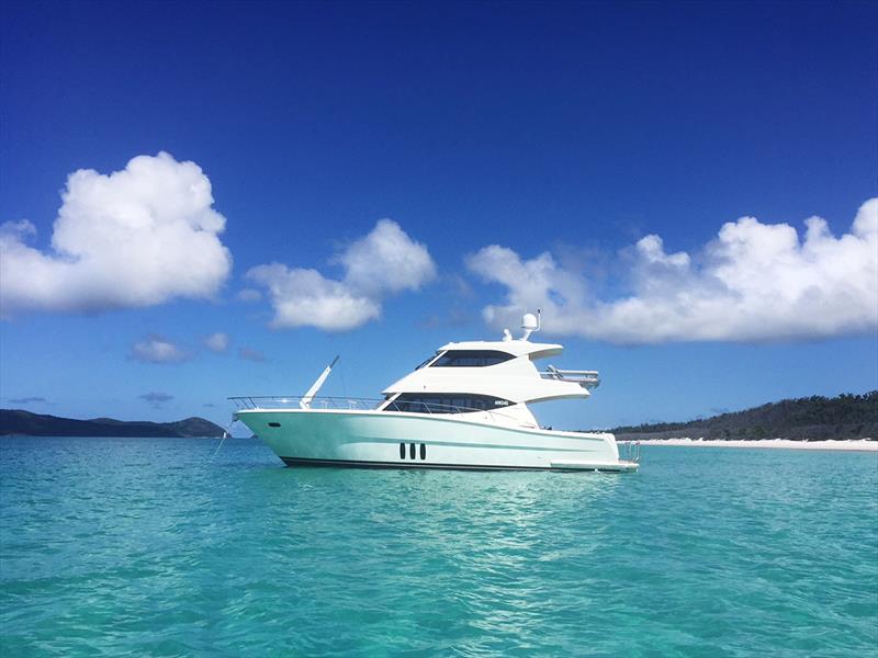 Anchored of Whitehaven Beach in the Whitsundays photo copyright Paul Wilson taken at  and featuring the Power boat class