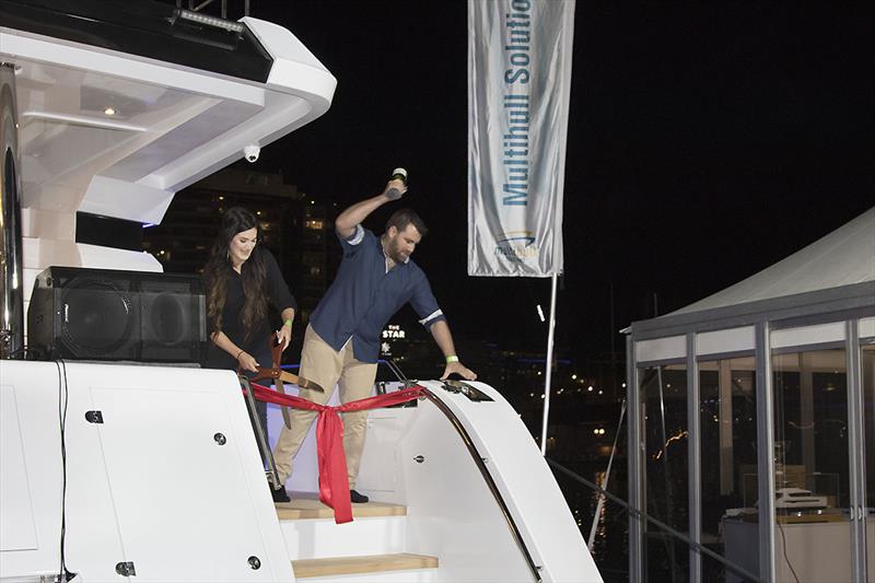 Christening the new ILIAD 70 at the Sydney international Boat Show - that Champagne bottle was not going to need a second attempt!!! photo copyright John Curnow taken at  and featuring the Power boat class