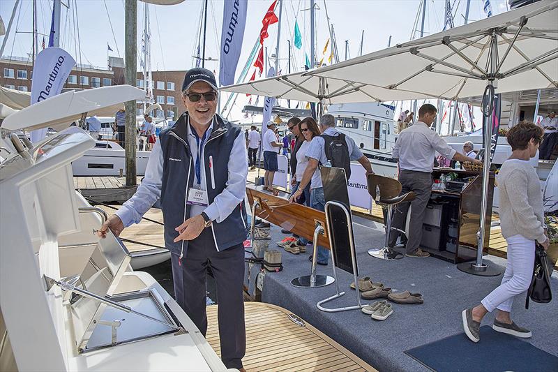 Maritimo America's President, Dave Northrop, proudly displaying the vessels at the Newport show photo copyright Billy Black taken at  and featuring the Power boat class