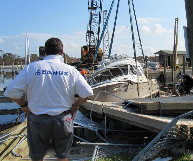 The GEICO | BoatUS Marine Insurance Catastrophe Team recovers an insured's vessel at the Oyster Bar Marina in Pensacola, Florida photo copyright Scott Croft taken at  and featuring the Power boat class