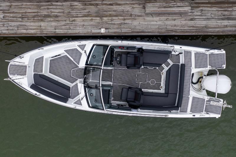 The open space in the Cross 75 BR is generously dimensioned, and there is also plenty of space on the swimming platforms and canopy stowage cover, making it easy to both board the boat and enjoy water sports. - photo © Yamarin Cross