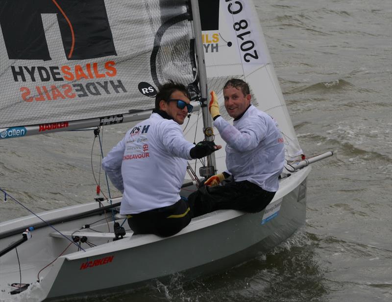 Smiles of success as Ben Saxton and Toby Lewis cross the finish line in the final race of the Endeavour Trophy 2019 photo copyright Sue Pelling taken at Royal Corinthian Yacht Club, Burnham and featuring the RS200 class