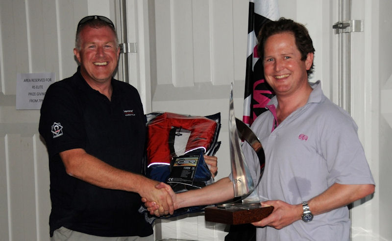 Ashley Dean collects the Crewsaver RS Elite Stadium Cup Trophy 2012 from Greg O’Brien of Crewsaver photo copyright Steve Powell taken at Cowes Combined Clubs and featuring the RS Elite class