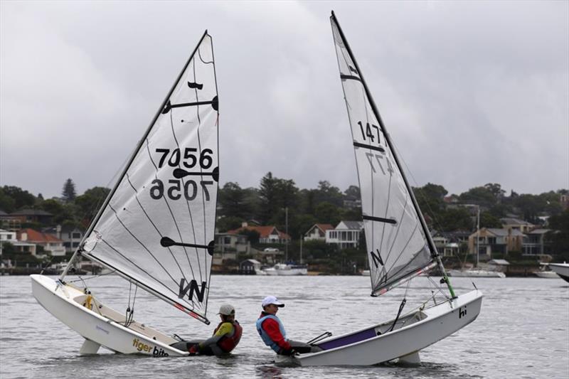 Serious fun in between races - LC12'SSC sailors - Eoin Cullinane (7056, Tiger Bite) with Max Nicholson (1477, Missing in Action)  photo copyright Sam Gong taken at Lane Cove 12ft Sailing Skiff Club and featuring the Sabot class