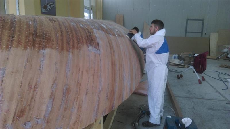 Croatian Gajeta build - more sanding after the second layer has cured - photo © West System International